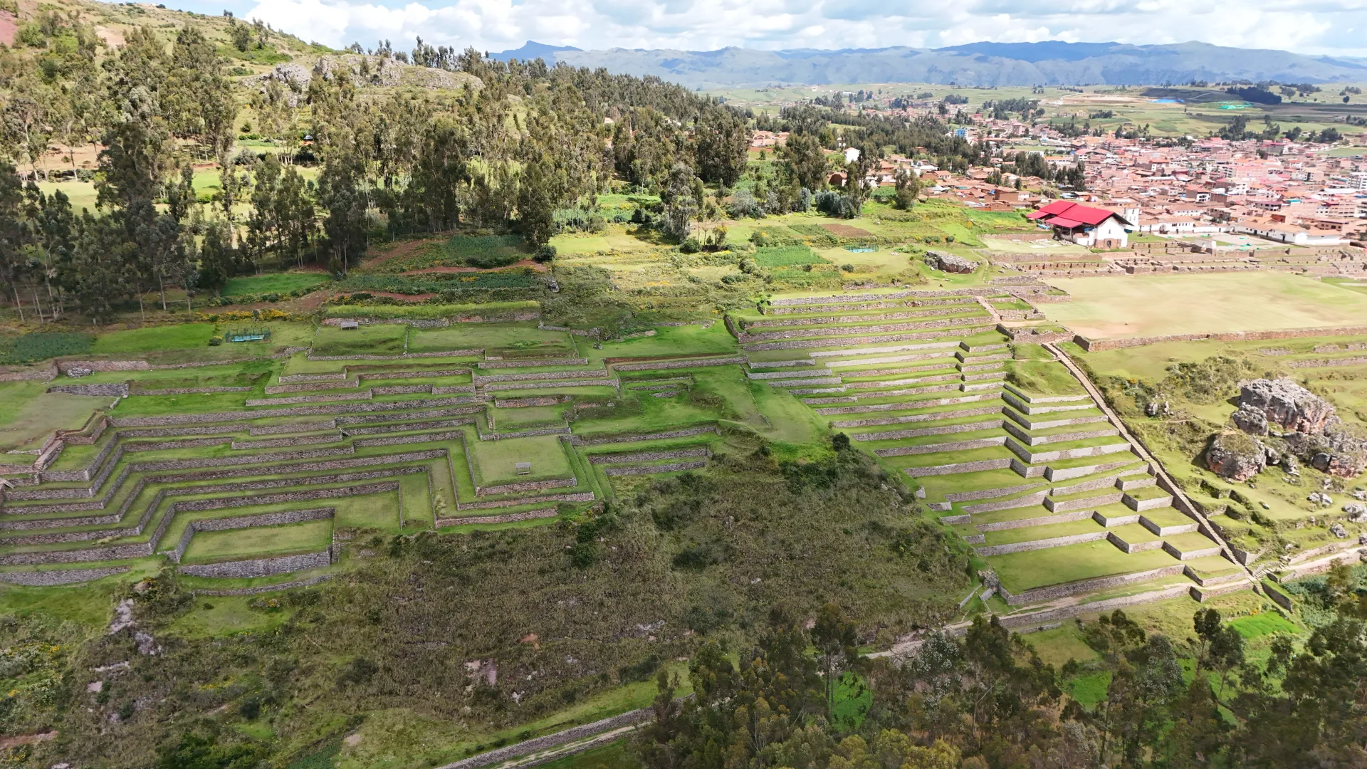 Inca terraces of Chinchero from the air, with the village behind