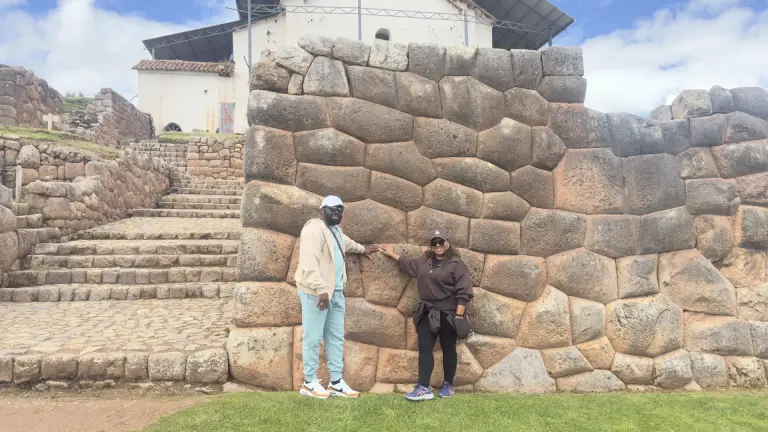 Inca walls and stairway beside the colonial church of Chinchero
