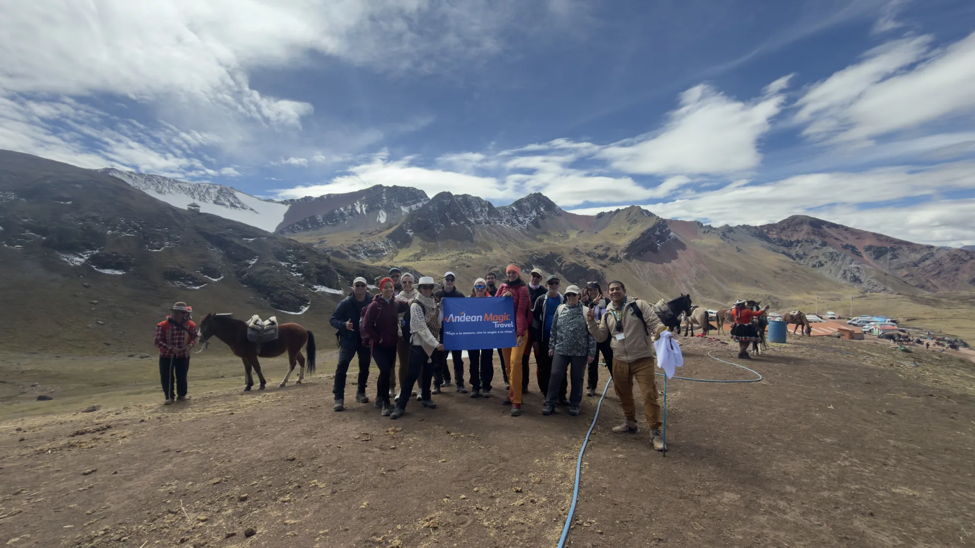 Group at the start of the Rainbow Mountain hike, with horses