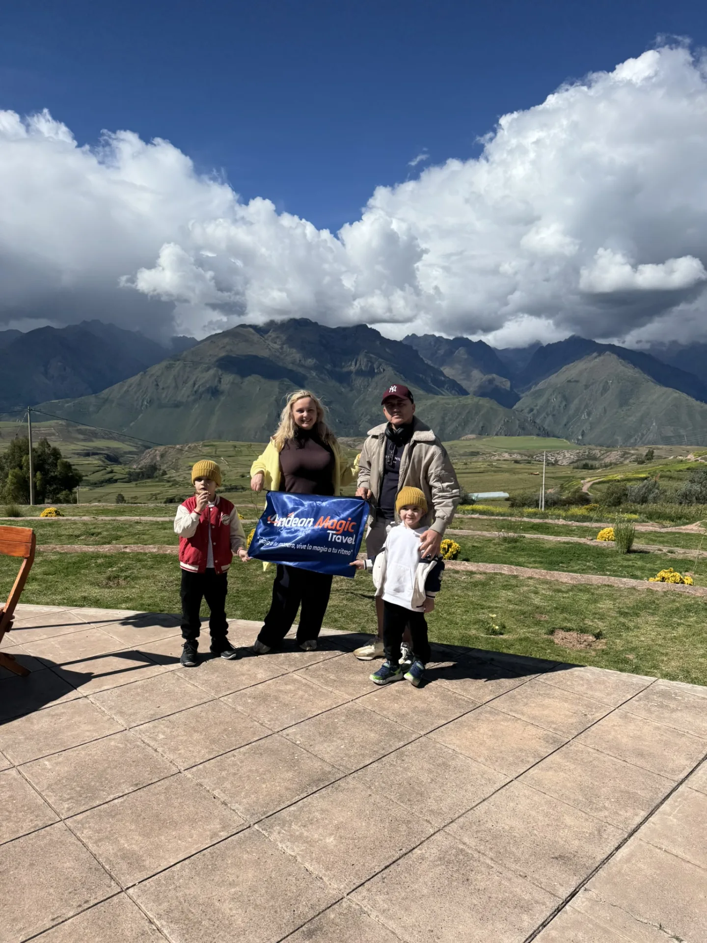 Family with children at a Sacred Valley viewpoint, Andean Magic Travel private tour