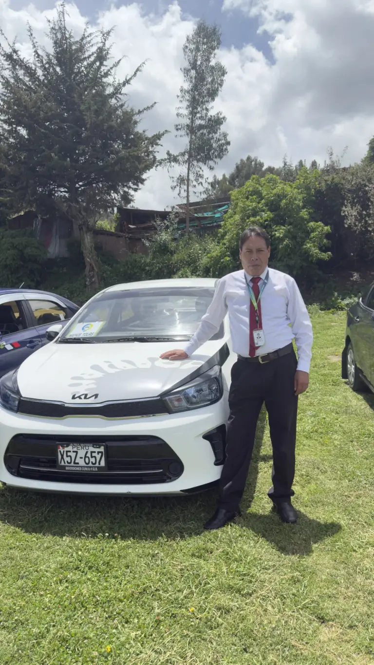 Andean Magic Travel driver next to a white car