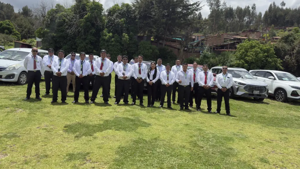 Andean Magic Travel drivers in uniform next to the vehicles