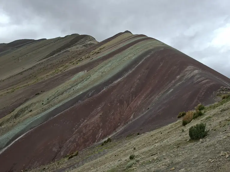Slope of Rainbow Mountain with its red, green and ochre mineral bands